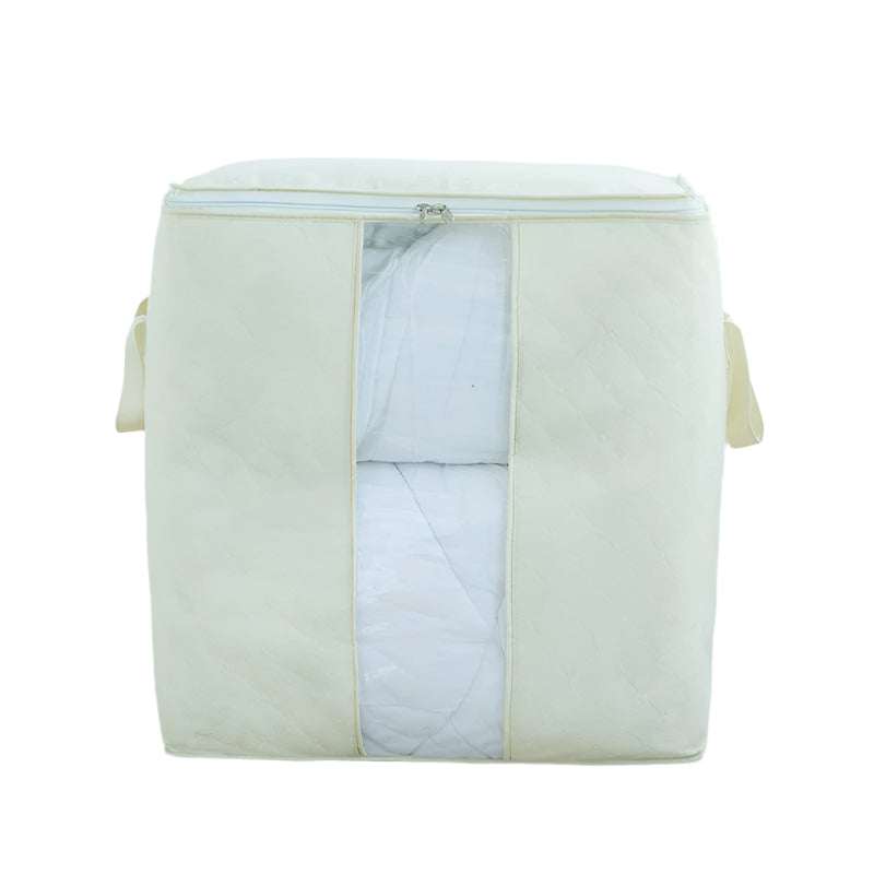 Beige quilt storage bag with reinforced handles in a storage room setting.