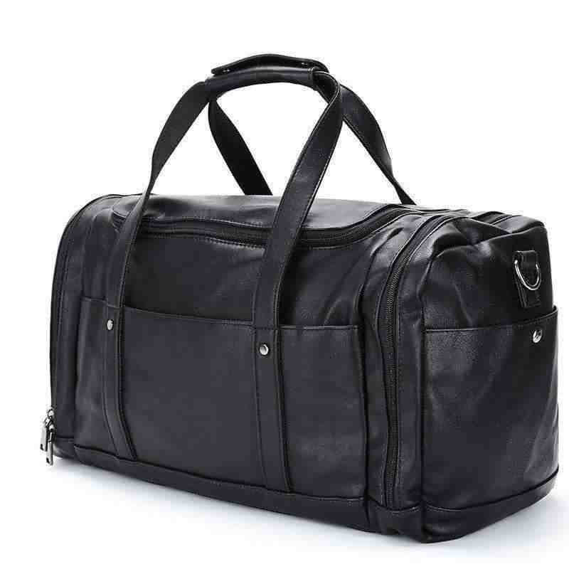 Black PU men's travel bag with multiple compartments and handles, fashion trend style.