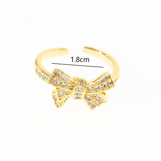 Gold-plated adjustable ring with diamond bow design and copper plating measuring 1.8cm wide