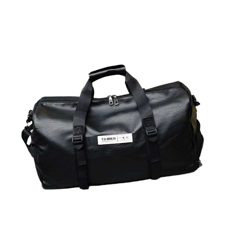 Black portable travel bag with durable fabric and sturdy handles.
