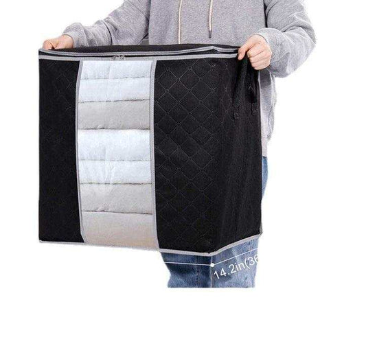Non-woven luggage packing bag for storage, shown in black and grey, suitable for quilts and clothing.