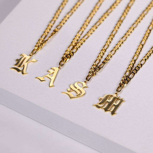Stainless steel English nameplate necklaces with customizable letters and gold Cuban chains unisex design