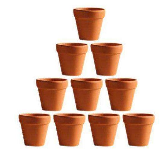 10 small mini clay pots arranged in a pyramid formation.