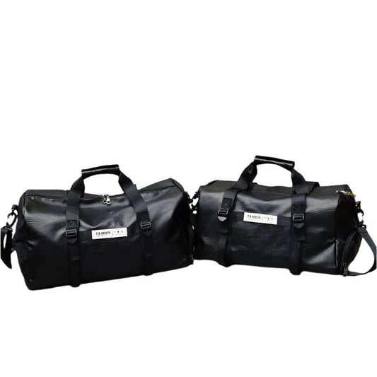 Black portable travel bags with adjustable straps, premium fabric, displayed on a concrete floor.