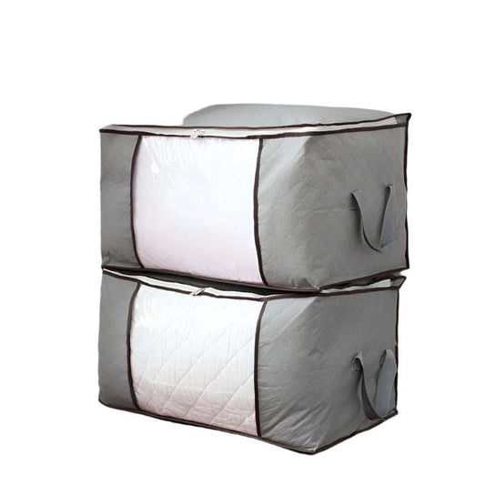 Quilt storage bag in gray, oversized non-woven fabric with handles, suitable for sweaters and clothing, in a storage room setting.