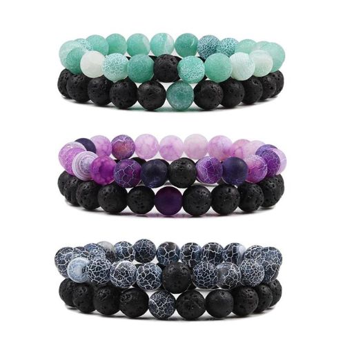 Close-up of an energy bracelet made of hand-polished natural crystal stones with unique textures for protection and confidence