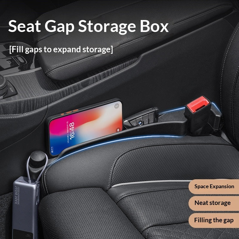 Car seat gap seal strip clip in black installed to fill gap between car seat and center console with phone and accessories storage