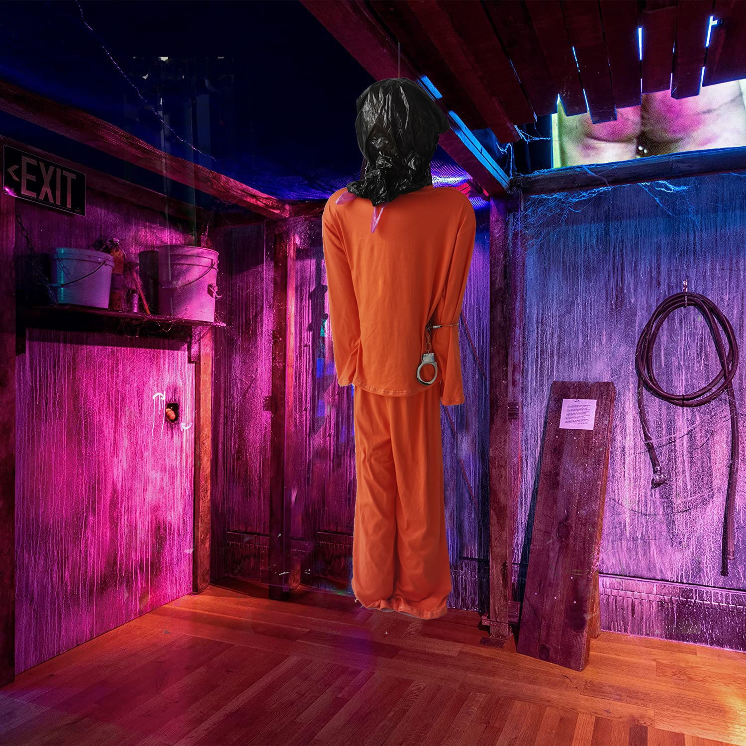 Realistic prisoner corpse Halloween decoration in the basement 
