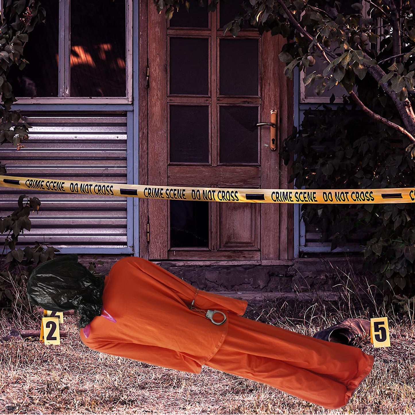 Realistic prisoner corpse Halloween decoration in the front door 