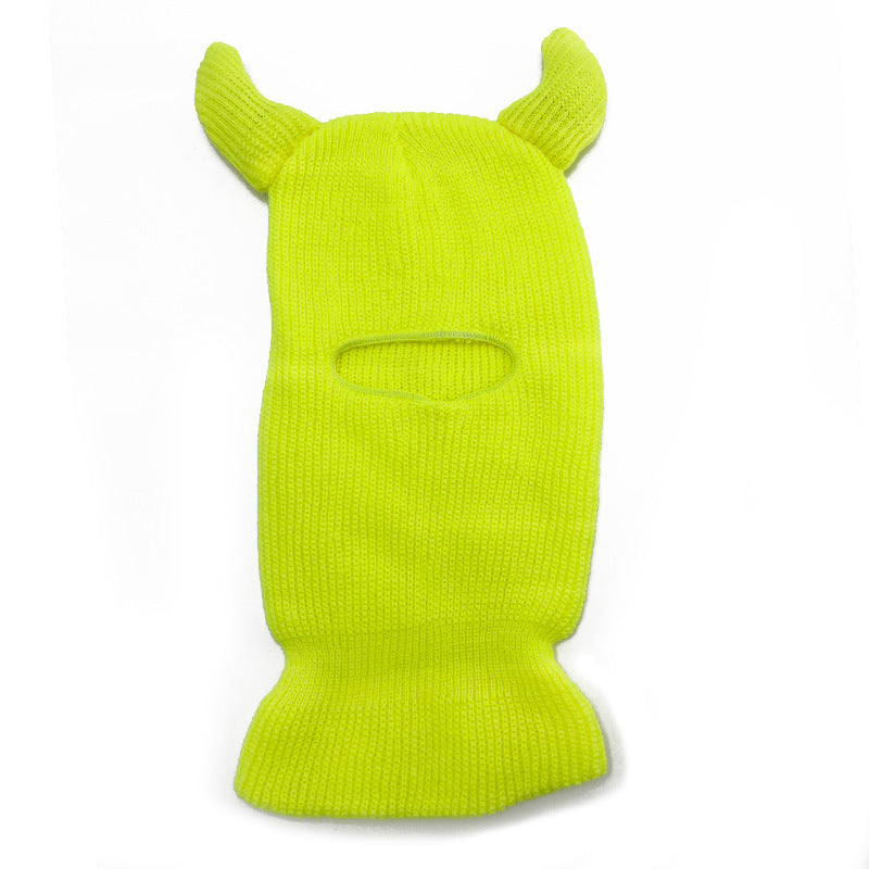 Bright green ski mask with animal ears on a white background