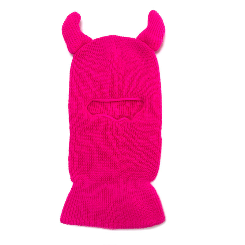 Bright pink balaclava with animal ears on a white background