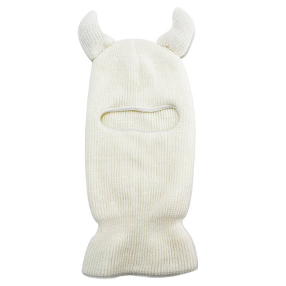 White knit balaclava with animal horn designs on a white background