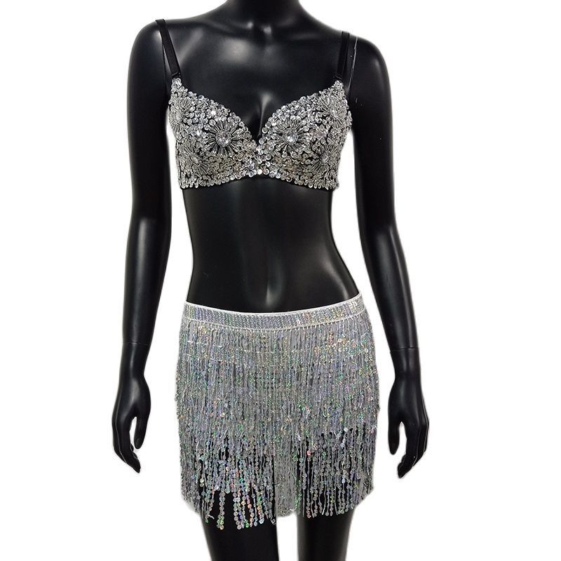 Mannequin wearing a silver beaded top and fringe skirt on a white background